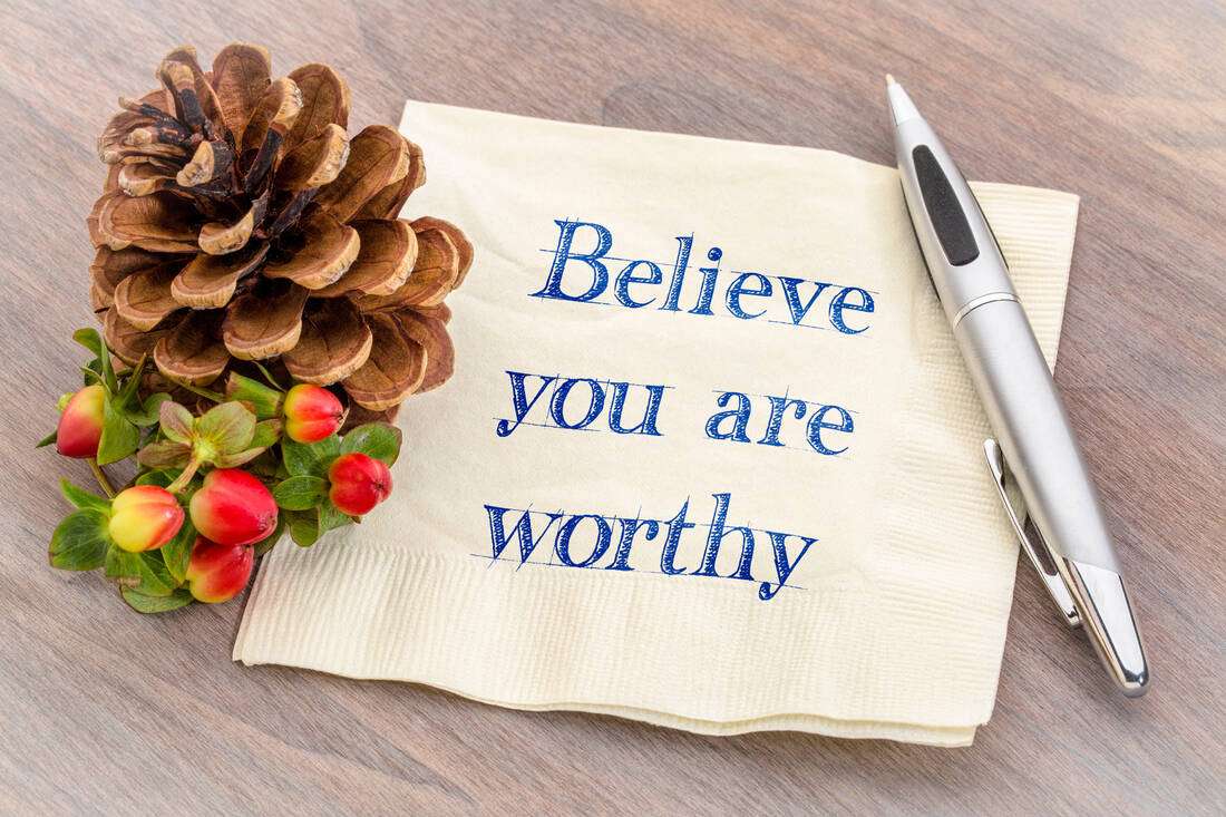 A note that reads Believe you are worthy