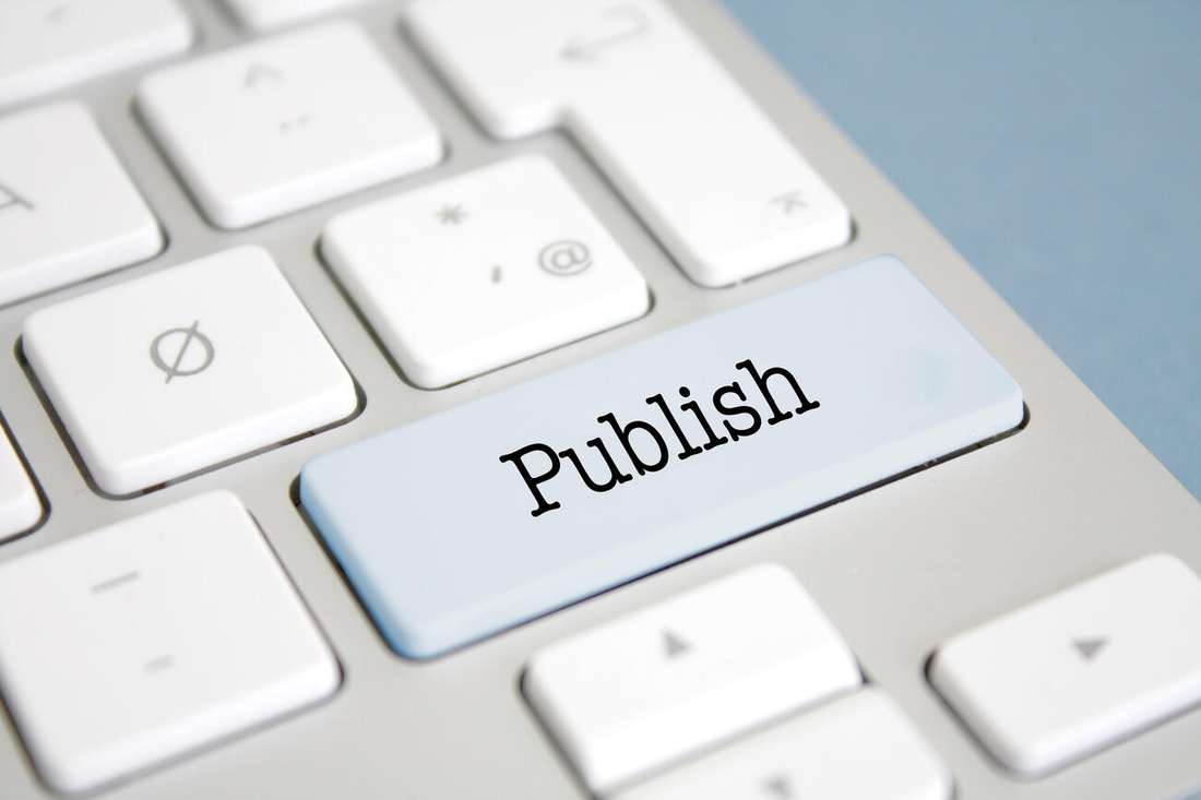 A keyboard with a light blue key labelled Publish