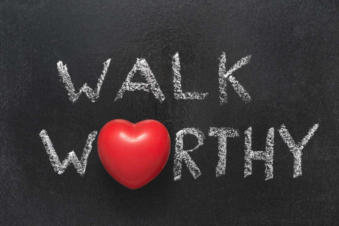 A chalkboard reading Walk Worthy with a red heart